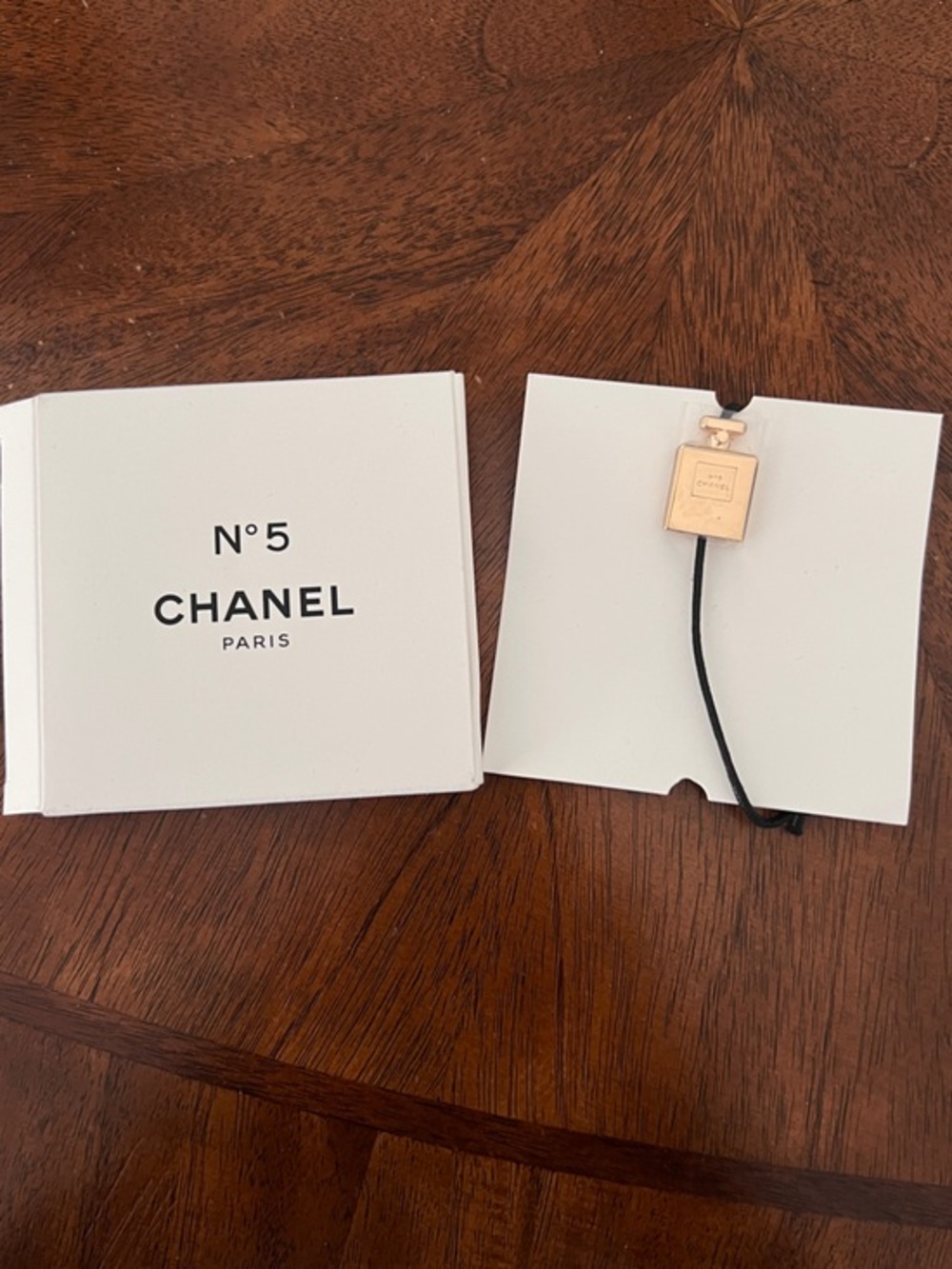 CHANEL • Charm Bracelet• Gold Perfume Bottle Charm on Black Cord